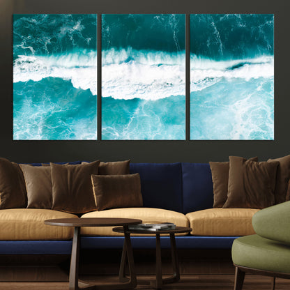 Aerial view of turquoise ocean waves crashing with white foam, perfect for tropical coastal or modern beach-style home decor.