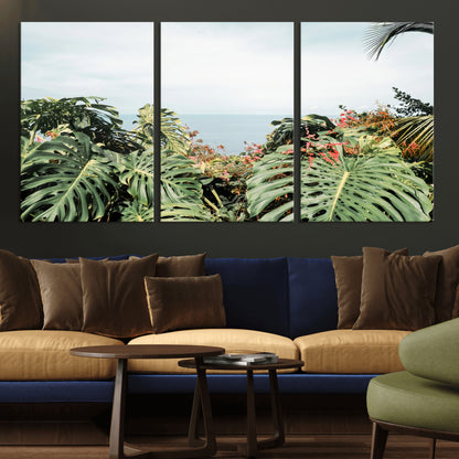 Monstera leaves and tropical flowers framing a calm ocean view, ideal for tropical coastal or exotic jungle-style interior wall decor.