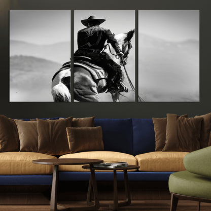 Black and white canvas of a cowboy on horseback with moody tones, perfect for rustic western or country-inspired home decor.