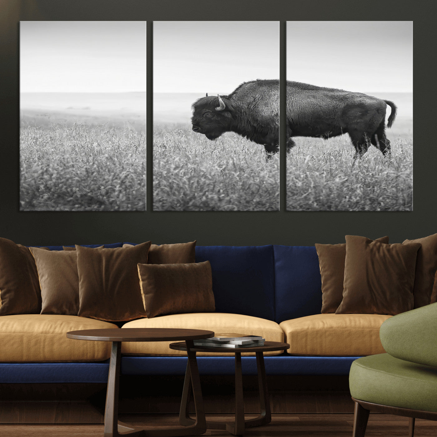 A black and white photograph of a majestic bison standing in a vast grassy prairie, evoking a sense of wilderness and strength.