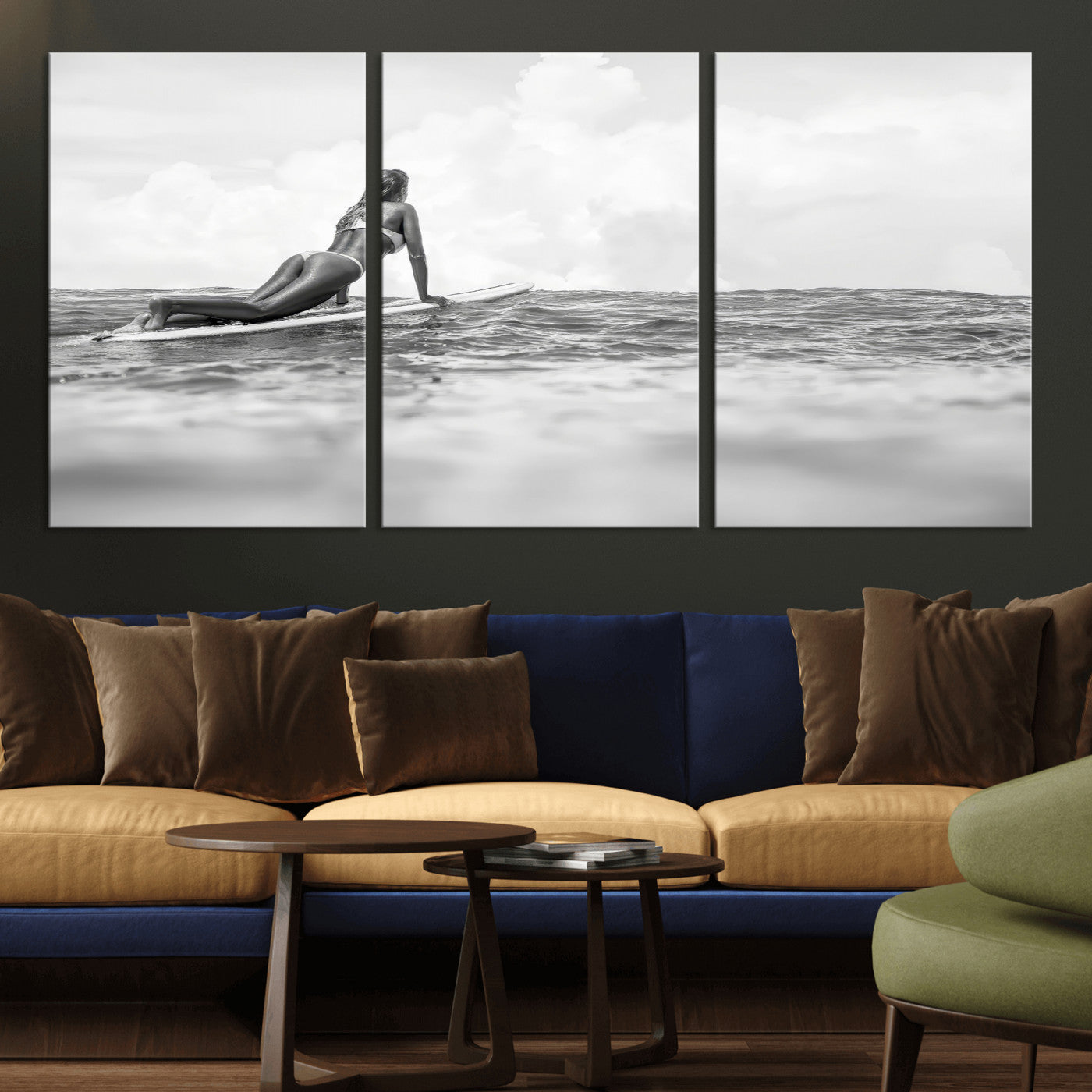 A black and white ocean scene featuring a surfer girl waiting on her board, gazing at the horizon, capturing a tranquil and adventurous coastal moment.