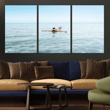 A peaceful minimalist scene of a person floating on crystal-clear water, surrounded by a vast open horizon, capturing relaxation and serenity in a tranquil aquatic setting.
