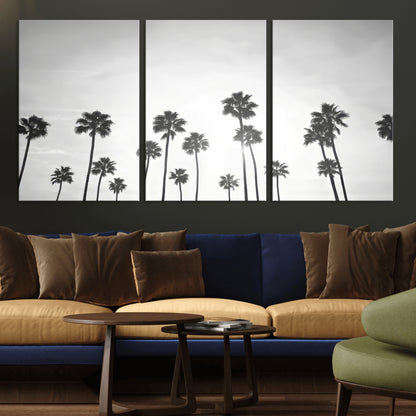 A black and white minimalist scene featuring tall palm trees silhouetted against a bright sky, creating a dreamy and timeless tropical aesthetic.