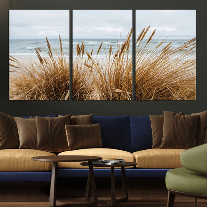 Canvas of golden beach grass swaying by the ocean under a soft cloudy sky, perfect for neutral-toned or coastal minimalist decor.