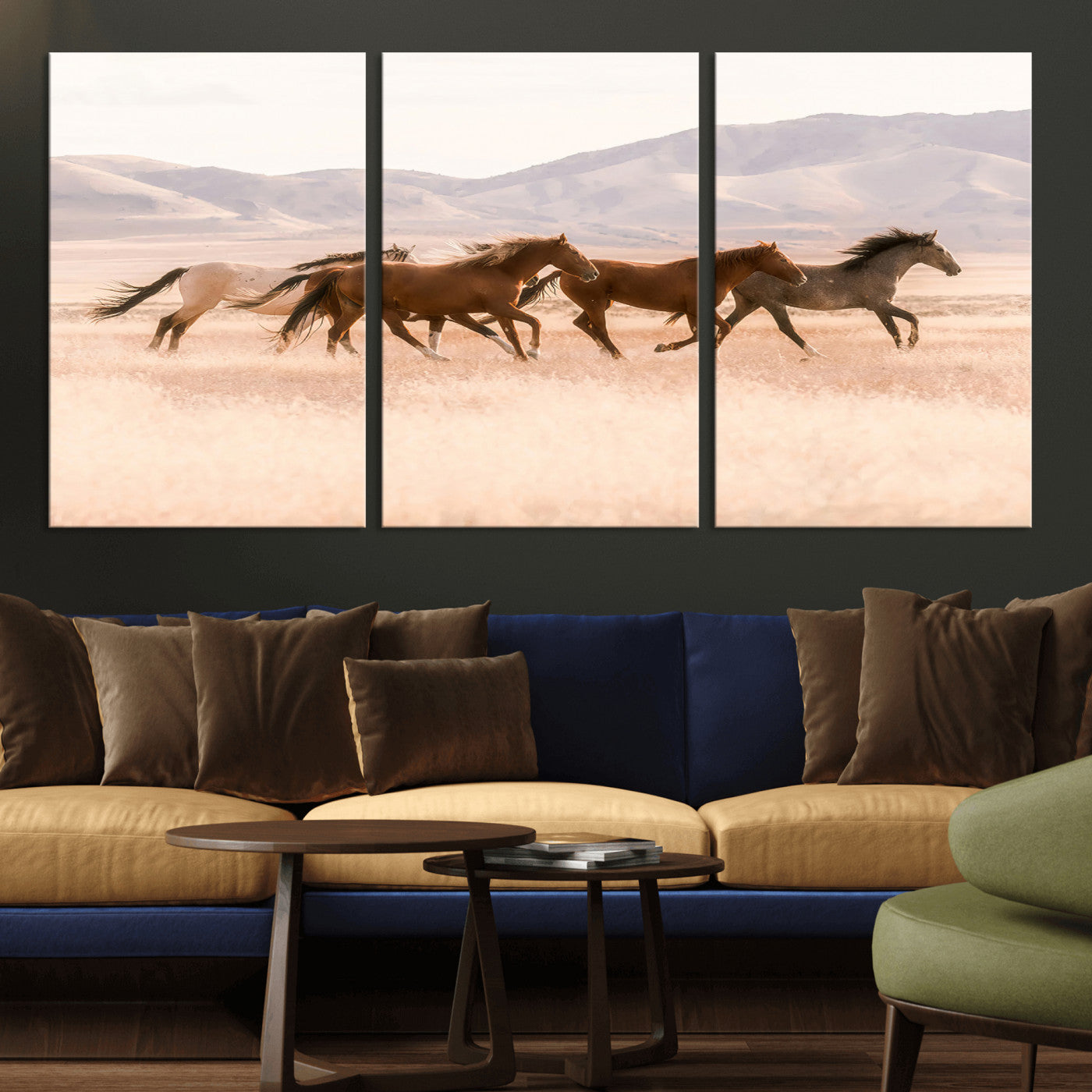 A herd of wild horses galloping through a sunlit desert plain with mountains in the background, perfect for rustic or western-themed wall decor.