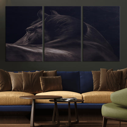 Close-up of a black horse with dramatic lighting on a dark background, perfect for rustic or masculine home decor.