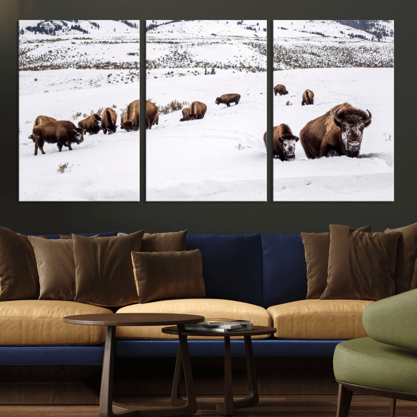 A herd of bison walking through deep snow in a mountain valley, perfect for rustic, cabin or western-themed wall decor.