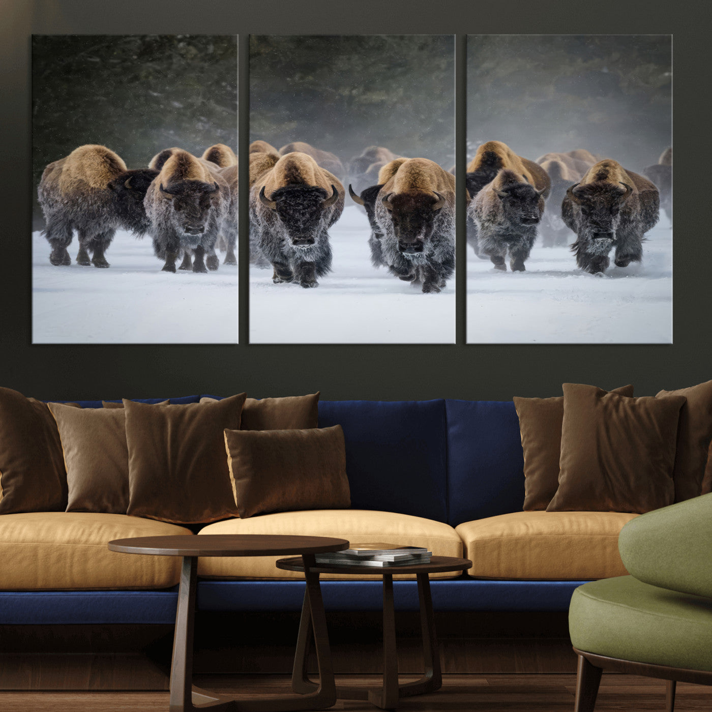A herd of American bisons walking through deep snow in a forest, evoking a powerful rustic wilderness mood for western-style interiors.