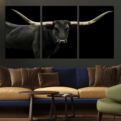 Close-up of a black Texas longhorn with large curved horns on black background, ideal for rustic farmhouse or modern western interiors.