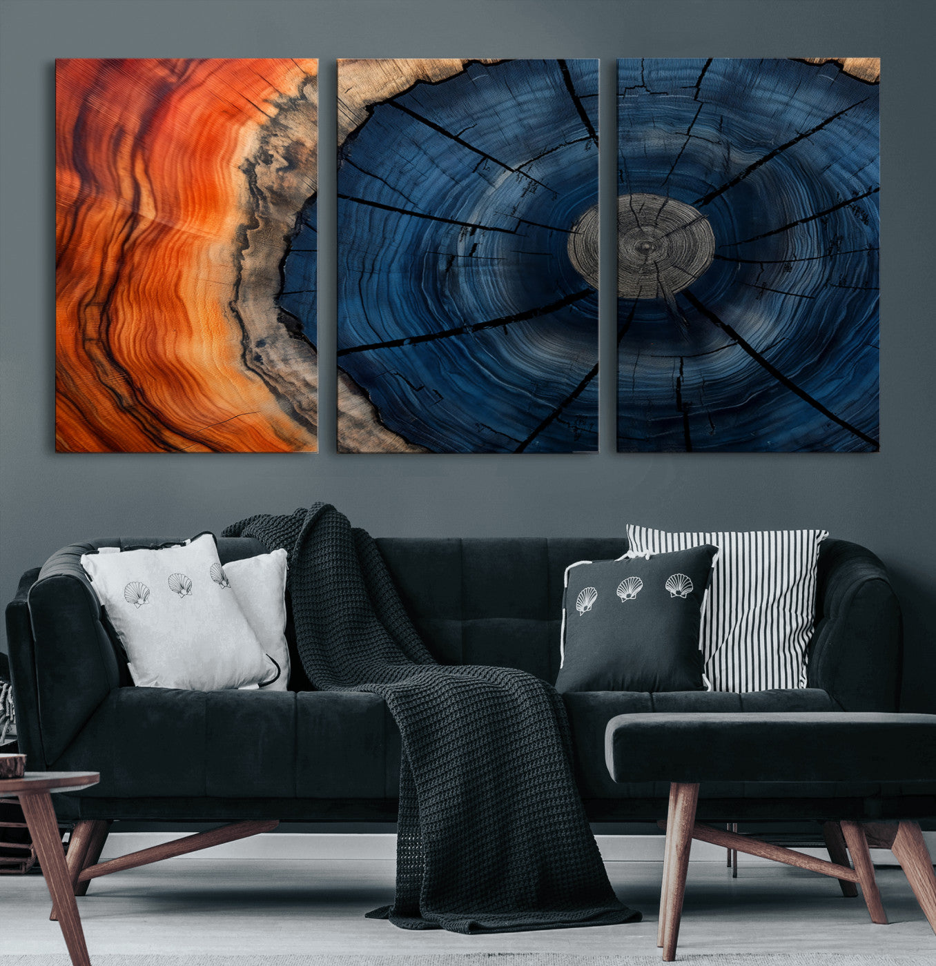 A captivating close-up of a tree trunk, showcasing its concentric rings in rich shades of blue, orange, and brown, highlighting the organic patterns of natural wood.