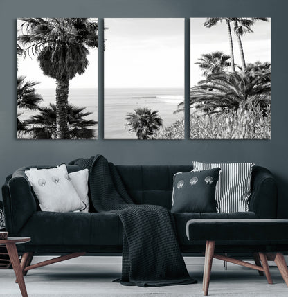 Monochrome canvas of palm trees framing a coastal surf scene, perfect for California-inspired or retro black-and-white beach decor.