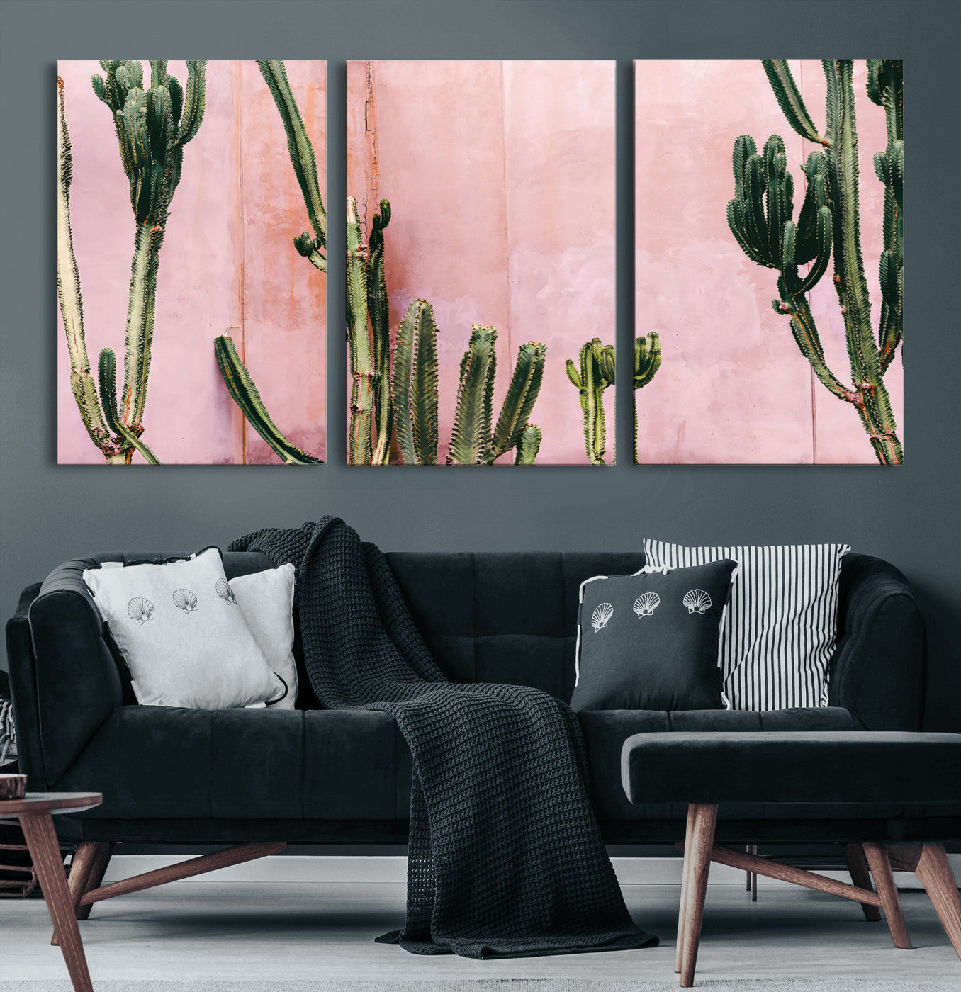 Framed canvas of tall green cacti against a soft pink wall, ideal for modern desert or colorful southwest-inspired home decor.