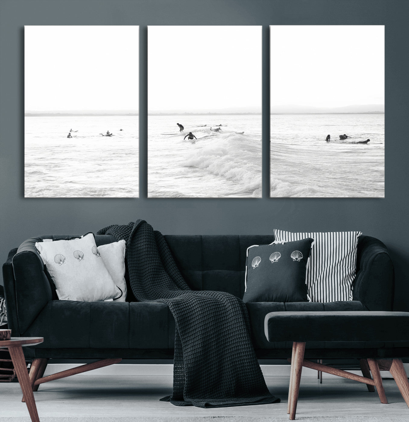 Monochrome photo of surfers riding and waiting on ocean waves, ideal for surf-themed or coastal energy wall decor.