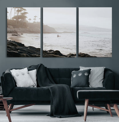Framed canvas of a surfer in misty coastal tones at a foggy California beach, ideal for minimalist coastal beach or serene ocean-themed decor.
