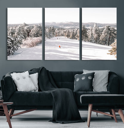 Bright ski trail lined with snow-covered pines and a skier in orange, perfect for alpine adventure or winter sports-inspired decor.