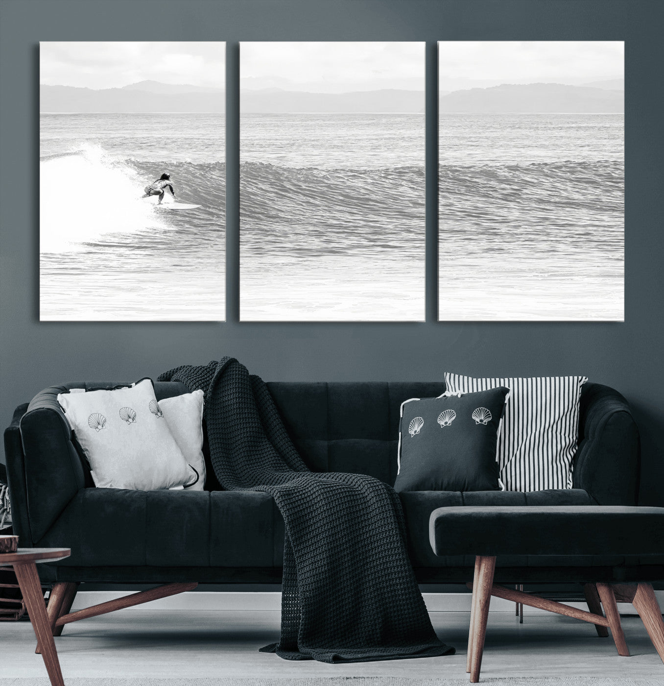 Monochrome photo of a surfer riding a wave with distant mountains, ideal for coastal motion or black and white surf-themed wall decor.