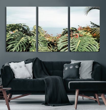 Monstera leaves and tropical flowers framing a calm ocean view, ideal for tropical coastal or exotic jungle-style interior wall decor.