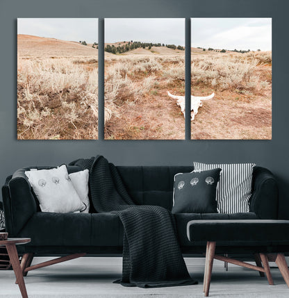 Rustic bull skull on dry sagebrush field under soft light, ideal for western minimal or desert prairie-style wall decoration.