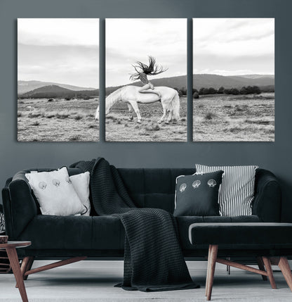 Black and white photo of a woman on a white horse in moody tones, ideal for Western Boho or modern rustic-style home decor.