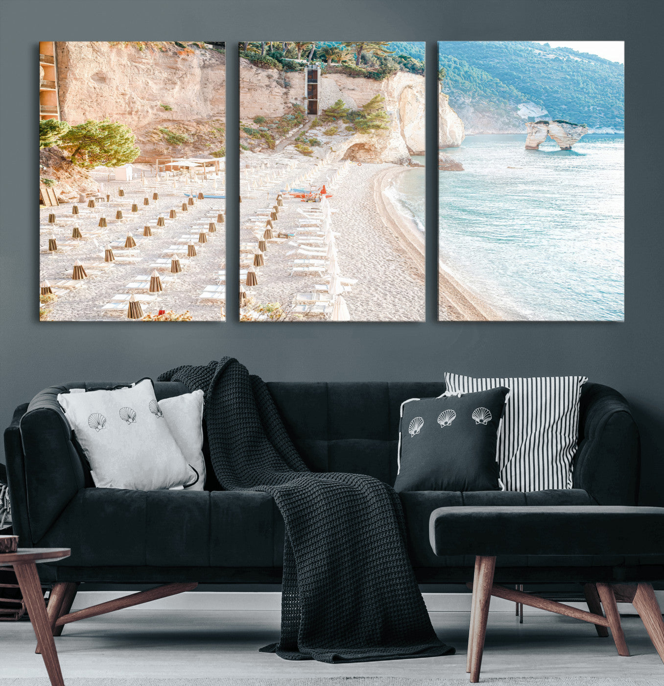 Wall art of a calm Mediterranean beach with rows of sun loungers and umbrellas in soft pastel tones, perfect for light coastal or vacation-themed decor.