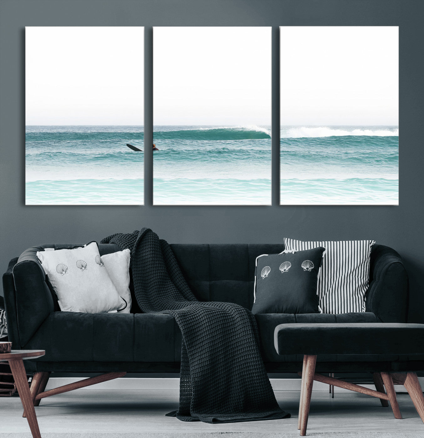 Minimalist photo of a lone surfer on calm aqua waves under bright sky, perfect for Scandinavian coastal or serene ocean-inspired home decor.