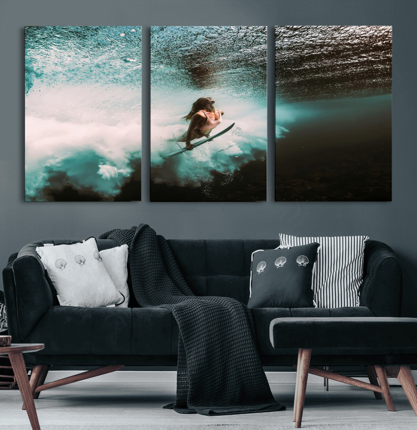 Vibrant underwater photo of a female surfer diving through turquoise waves, perfect for coastal boho or surf-inspired home decor.