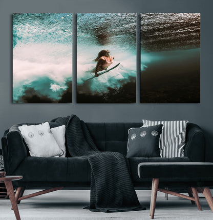 Vibrant underwater photo of a female surfer diving through turquoise waves, perfect for coastal boho or surf-inspired home decor.