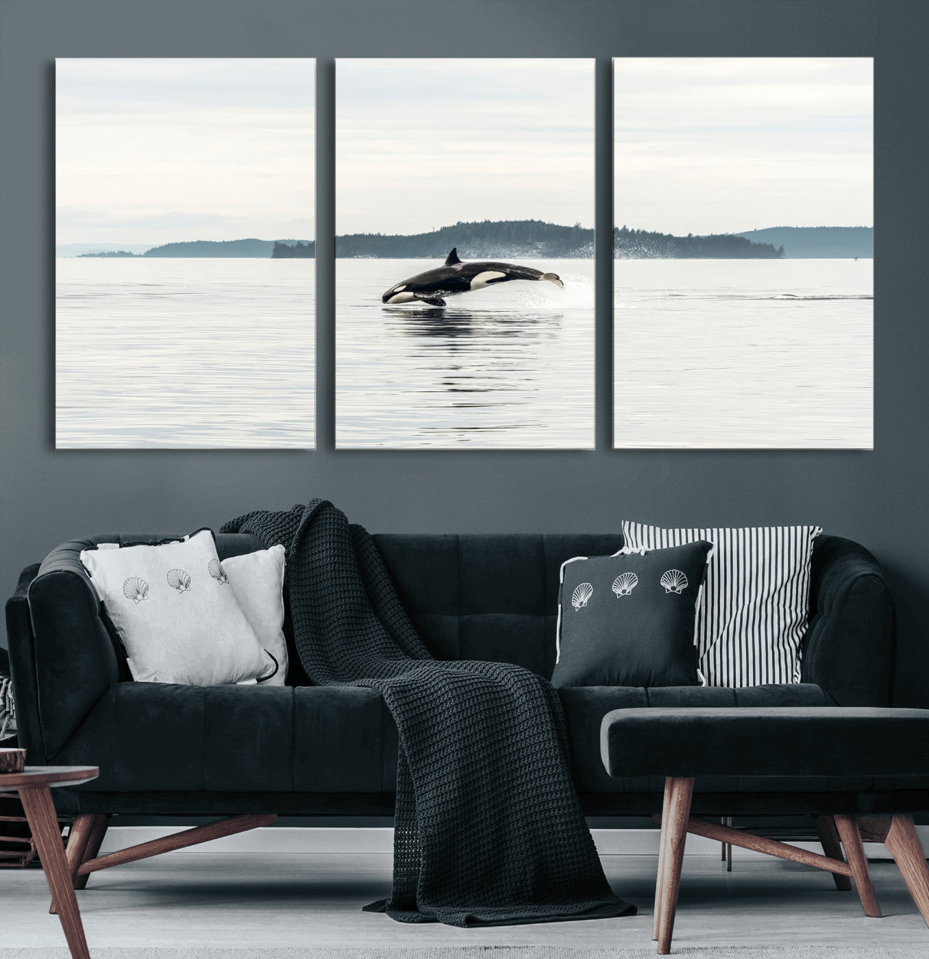 An orca jumping out of calm ocean waters with a misty island in the background, creating a serene and minimalist marine wildlife scene.