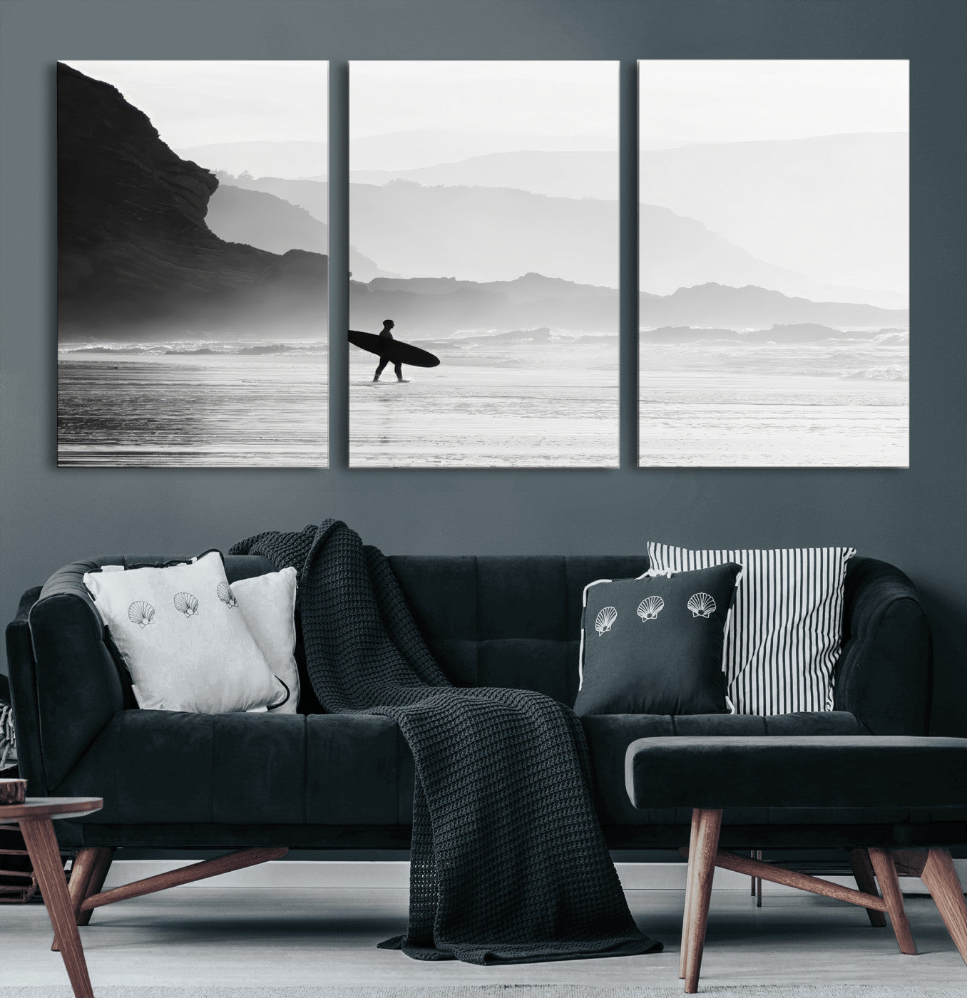 A lone surfer walking along a misty beach with cliffs in the background, carrying their board, capturing a serene and minimal ocean moment.