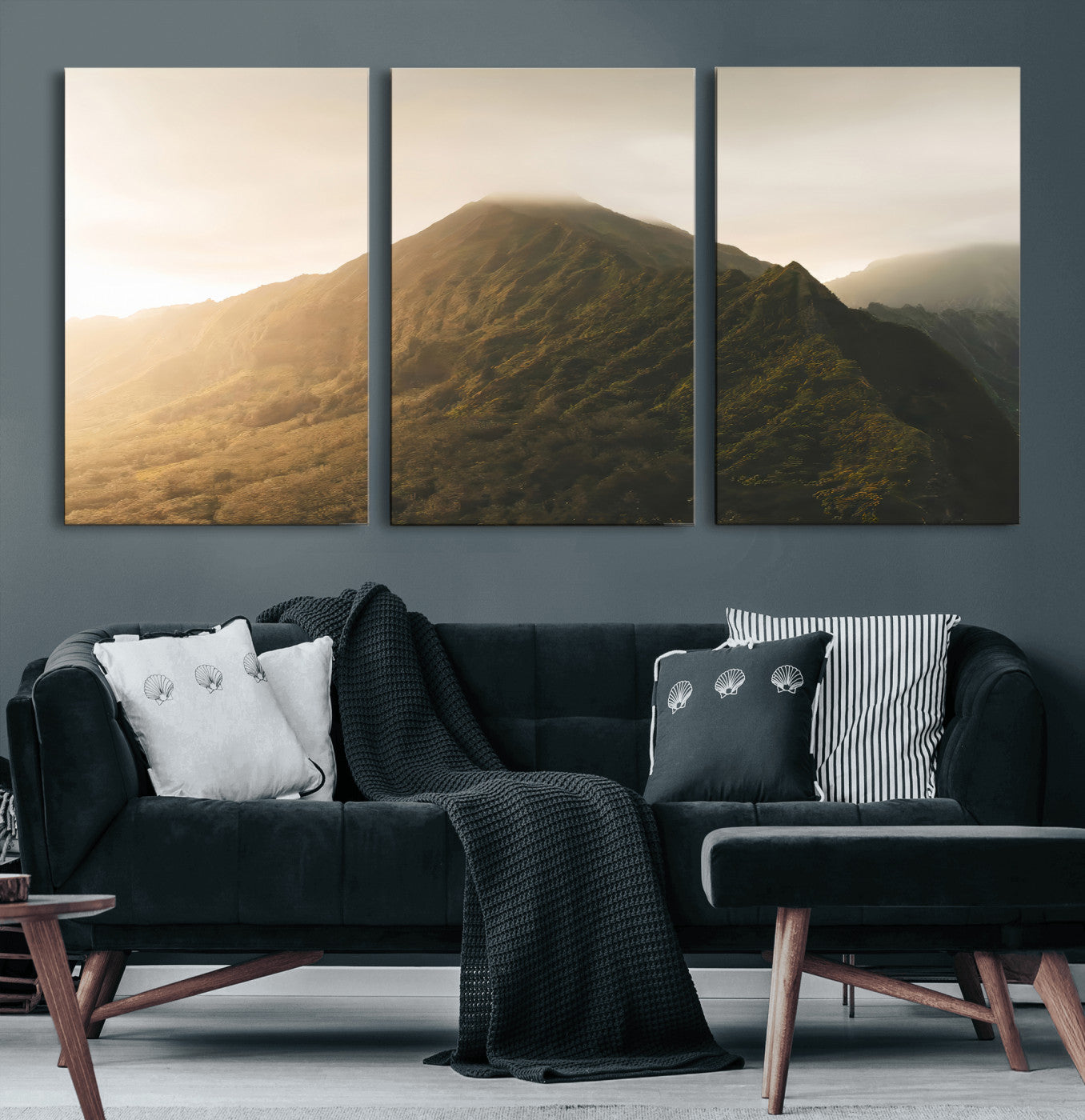 Sunlit mountain peak with mist rolling over its rugged slopes, bathed in golden light, creating a warm and tranquil nature-inspired scene.