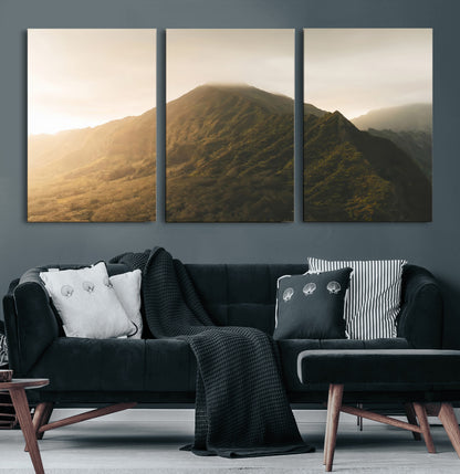Sunlit mountain peak with mist rolling over its rugged slopes, bathed in golden light, creating a warm and tranquil nature-inspired scene.