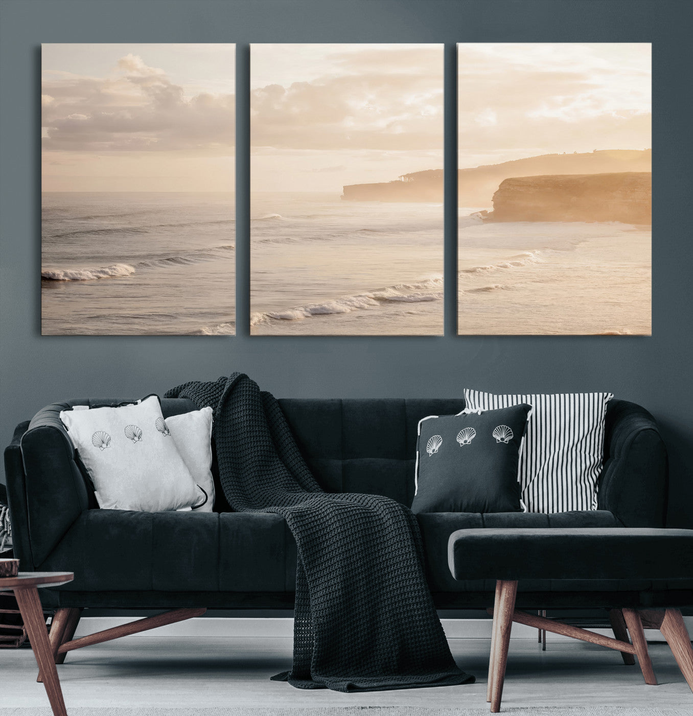 Golden hour seascape with misty cliffs and gentle waves rolling towards the shore, capturing a tranquil and warm coastal atmosphere.