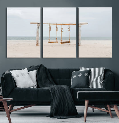 A rustic wooden beach swing stands on a serene sandy shore with an ocean horizon in the background, creating a tranquil and dreamy coastal escape.