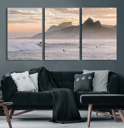 A surfer rides a golden hour wave near misty coastal mountains, surrounded by fellow surfers, capturing the spirit of a coastal adventure.