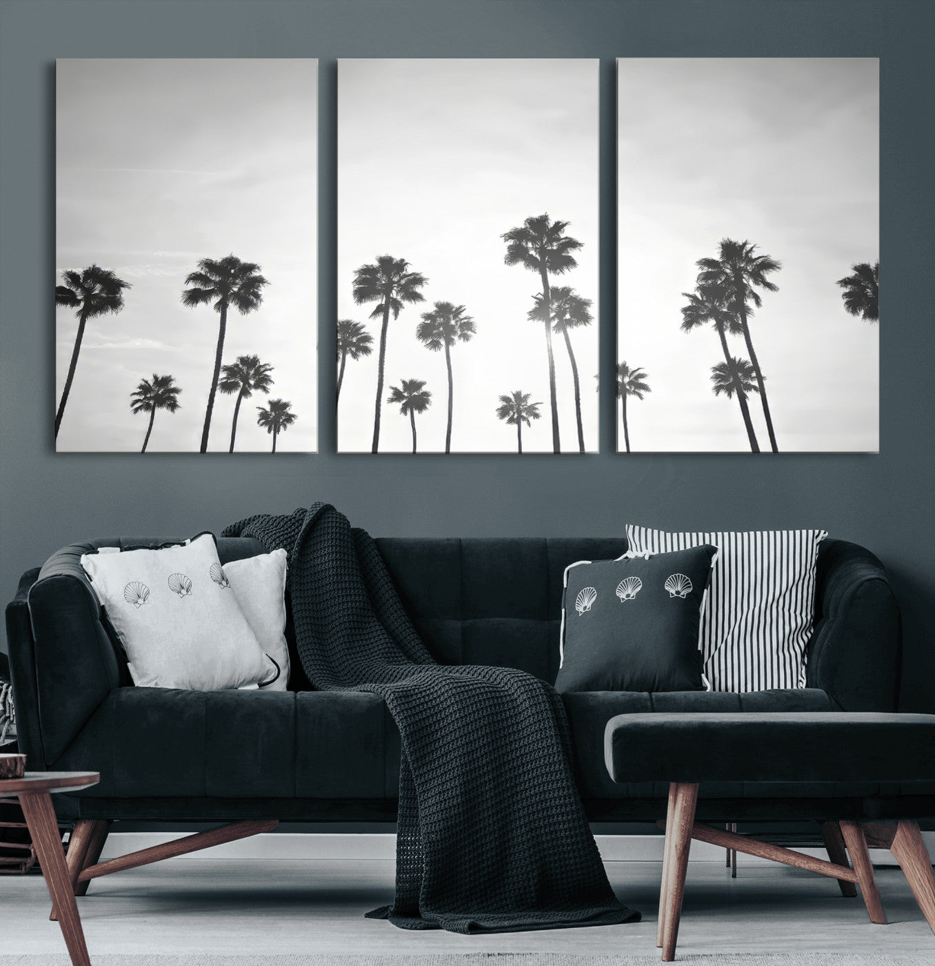 A black and white minimalist scene featuring tall palm trees silhouetted against a bright sky, creating a dreamy and timeless tropical aesthetic.