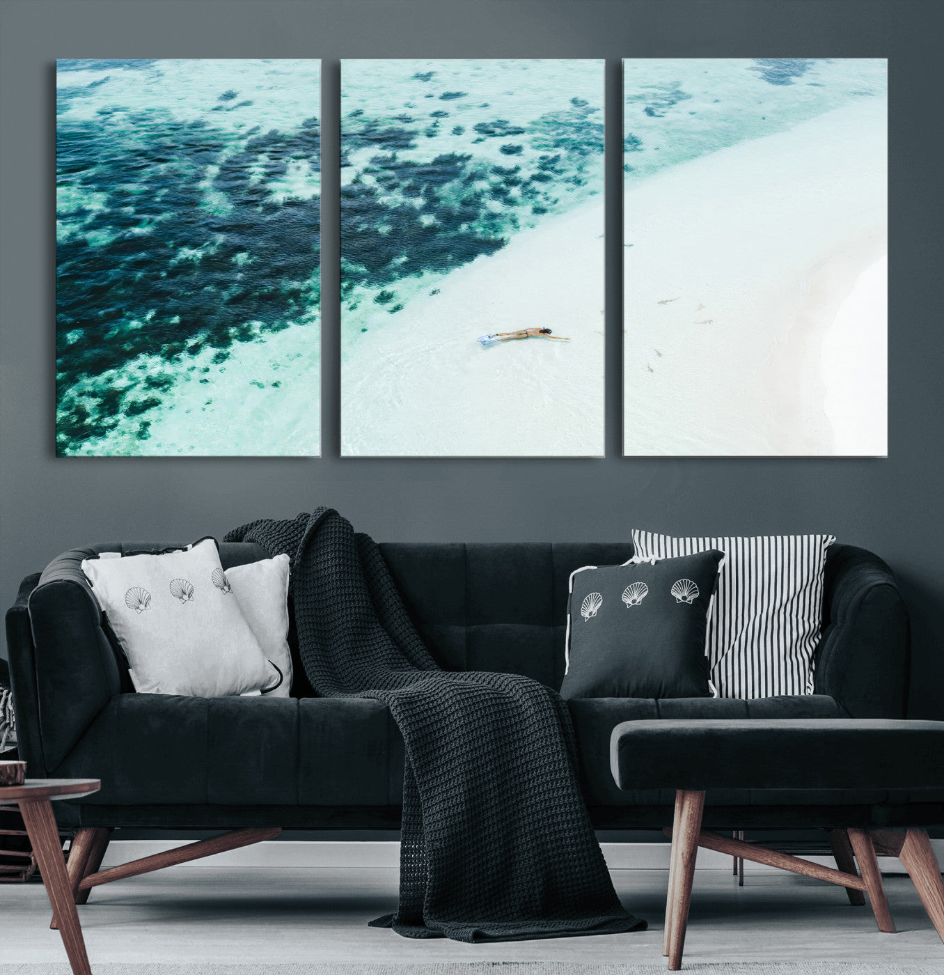 Canvas featuring an aerial view of a swimmer in shallow turquoise waters with coral patterns, ideal for tropical coastal home decor.