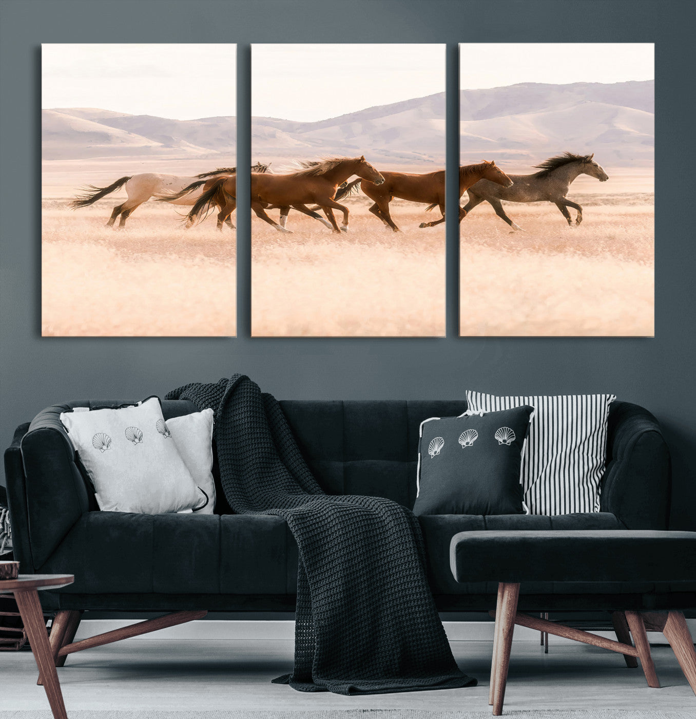 A herd of wild horses galloping through a sunlit desert plain with mountains in the background, perfect for rustic or western-themed wall decor.