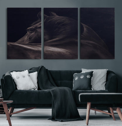 Close-up of a black horse with dramatic lighting on a dark background, perfect for rustic or masculine home decor.