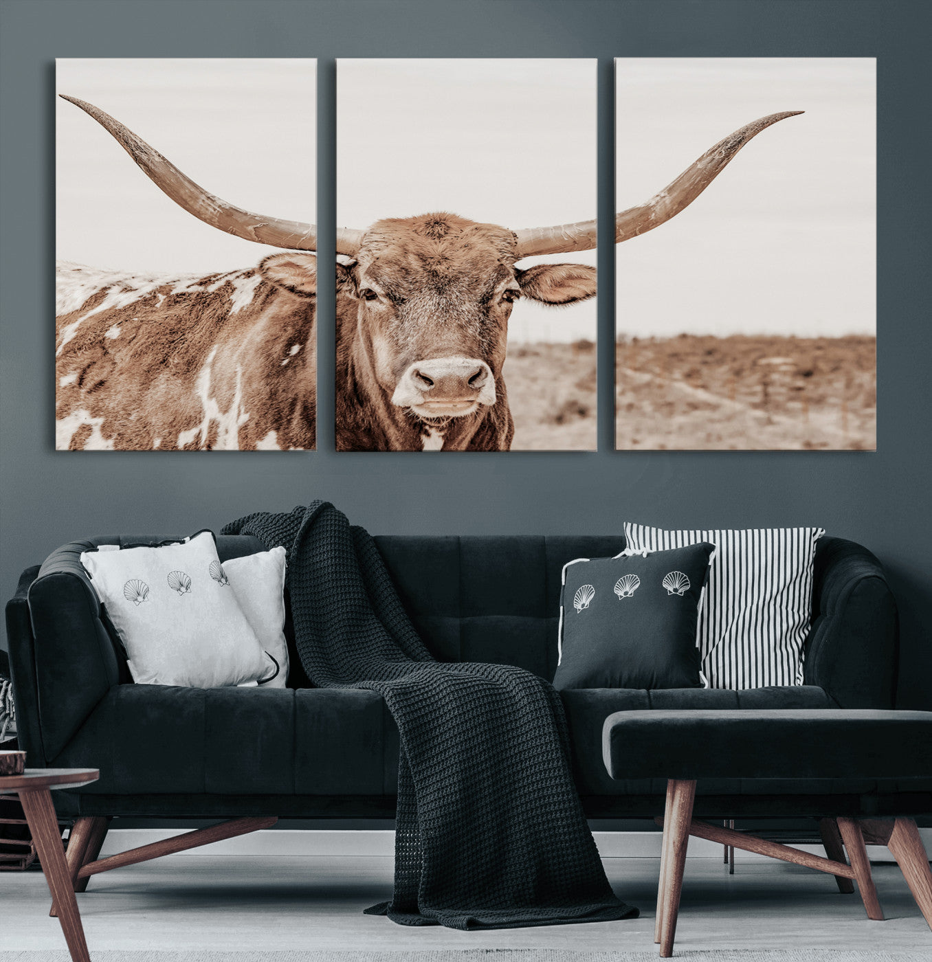 A longhorn cow in soft beige desert tones, standing calmly in open land, perfect for neutral western or rustic farmhouse interiors.