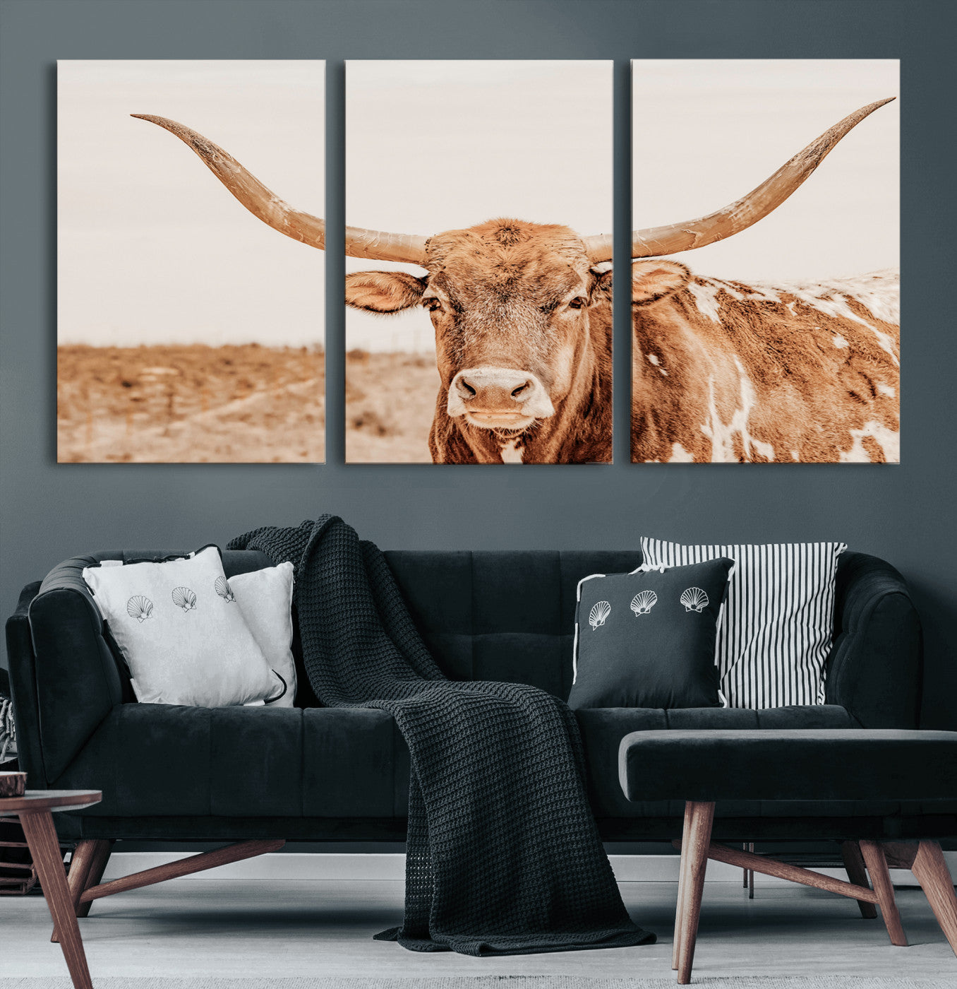 A longhorn bull standing proudly in a sunlit desert field with warm neutral tones, ideal for rustic western or farmhouse interiors.