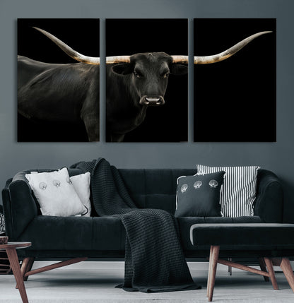 Close-up of a black Texas longhorn with large curved horns on black background, ideal for rustic farmhouse or modern western interiors.