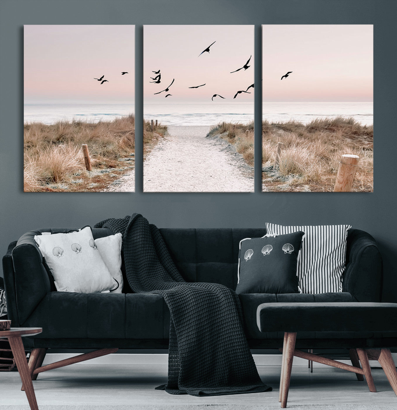 A peaceful coastal pathway leading to the ocean, with birds flying across a soft pastel sky, creating a calm and scenic beach atmosphere.