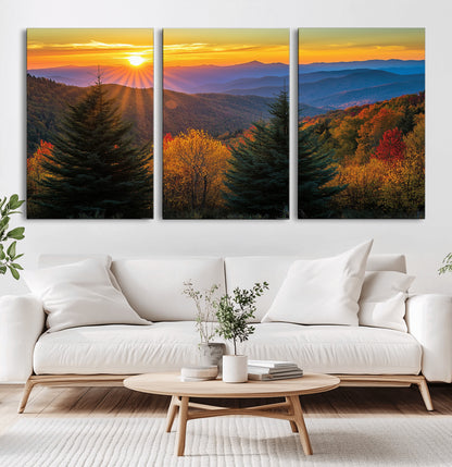 Vibrant sunset over autumn mountains with colorful trees and warm light, ideal for nature lovers or cabin-style wall decor.