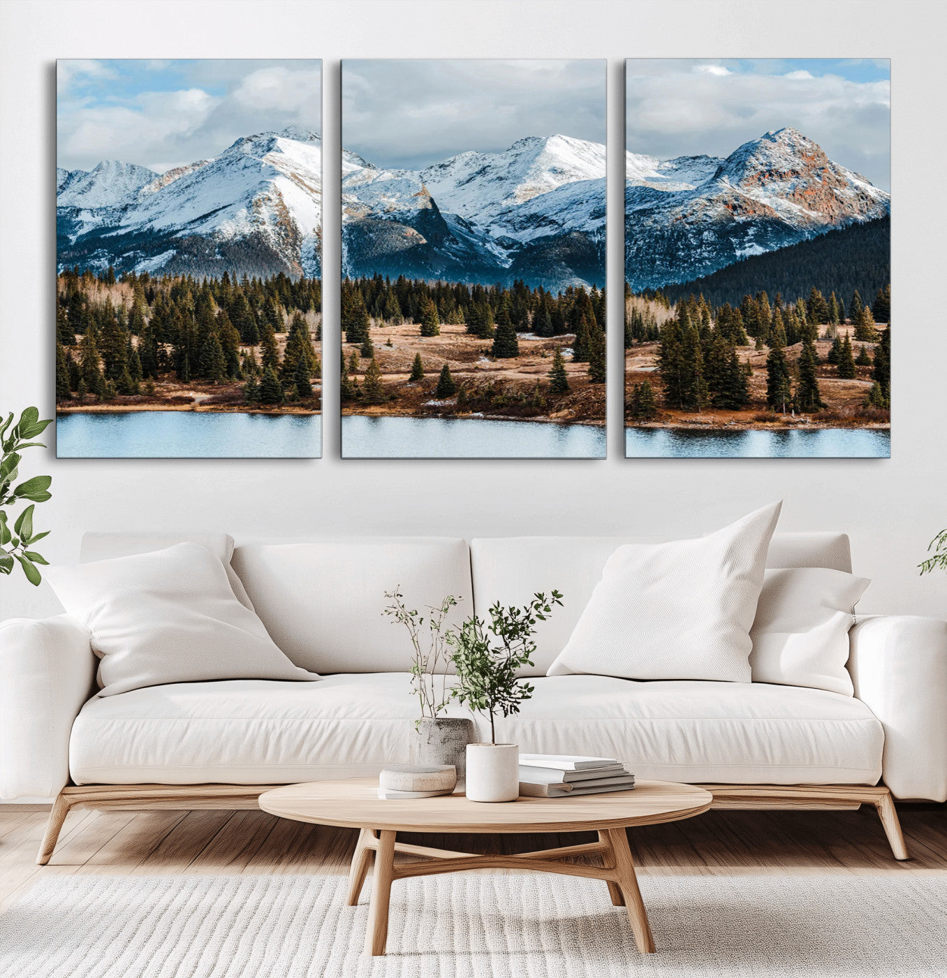 Framed canvas of snowy mountain peaks with pine forest and alpine lake, perfect for winter cabin or wilderness-inspired home decor.