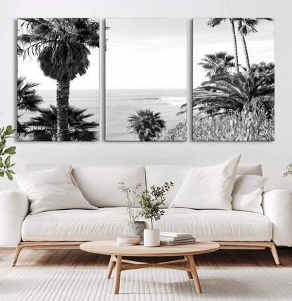 Monochrome canvas of palm trees framing a coastal surf scene, perfect for California-inspired or retro black-and-white beach decor.