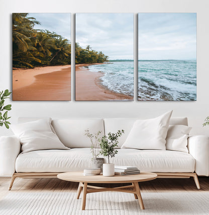 Framed canvas of a tropical beach with palm trees and soft waves, ideal for coastal escape or serene nature-inspired home decor.