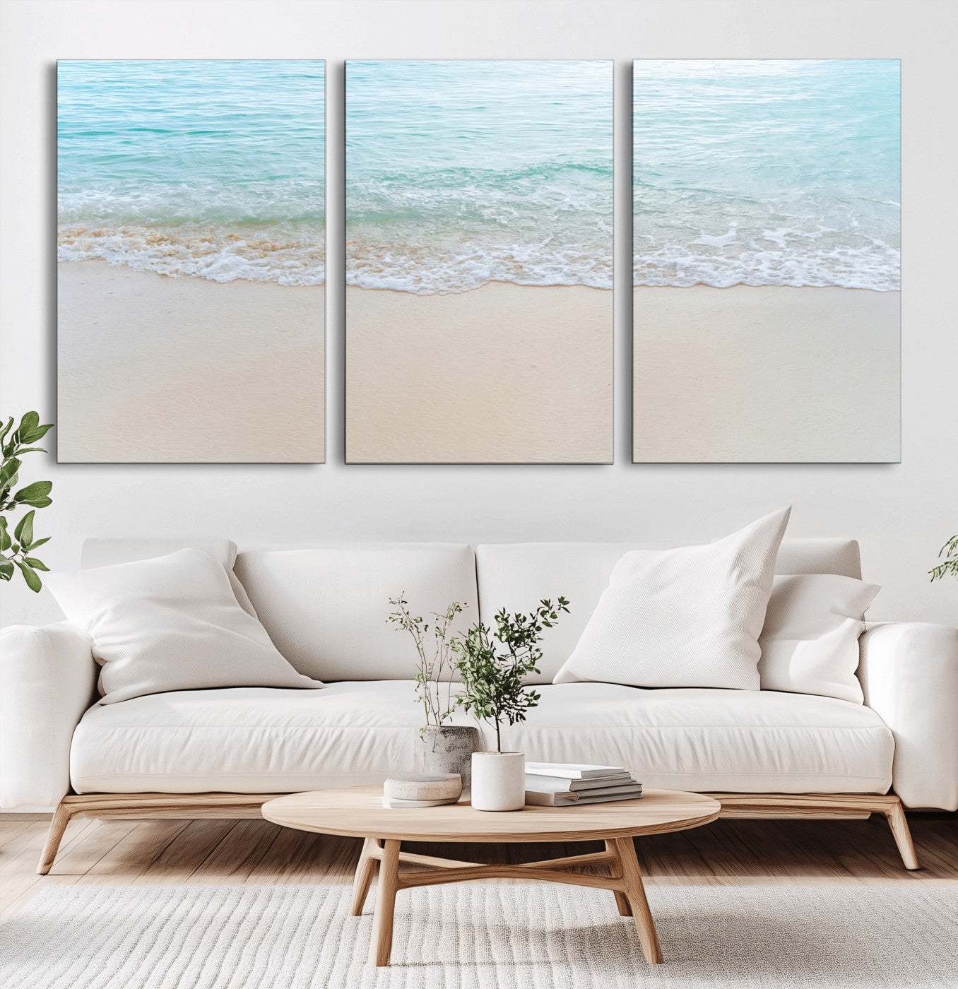 Soft shoreline with gentle aqua waves on smooth sand, ideal for minimalist coastal or pastel ocean-inspired home wall decor.