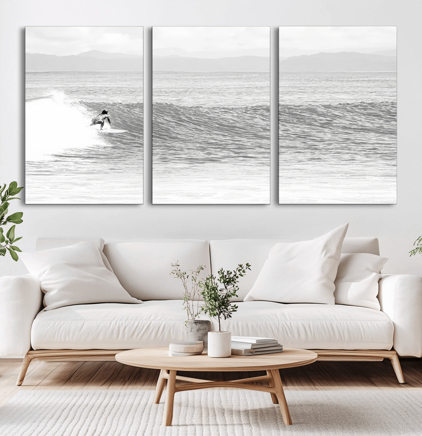 Monochrome photo of a surfer riding a wave with distant mountains, ideal for coastal motion or black and white surf-themed wall decor.