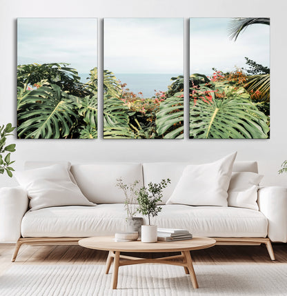 Monstera leaves and tropical flowers framing a calm ocean view, ideal for tropical coastal or exotic jungle-style interior wall decor.