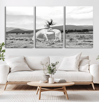 Black and white photo of a woman on a white horse in moody tones, ideal for Western Boho or modern rustic-style home decor.